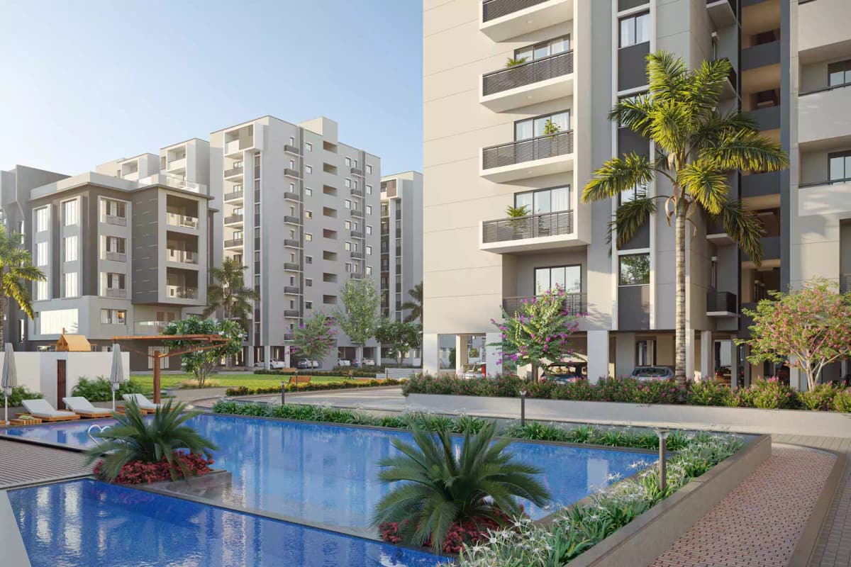 Abode Aravindam: Swimming pool with towers behind